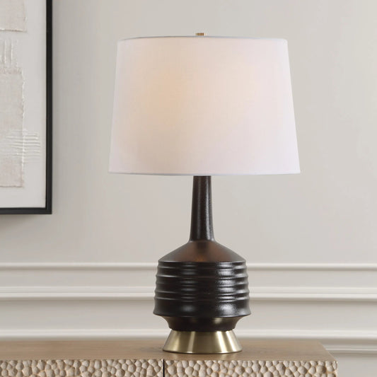 Foster Glaze Table Lamp by Uttermost in brass. Made from ceramic, metal, fabric in a modern style.