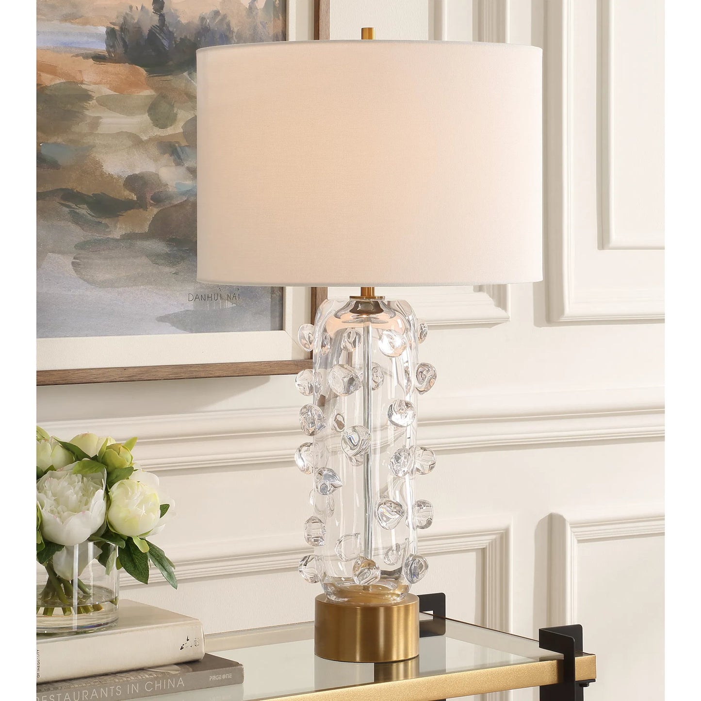 001 SI-2295251 | Lifestyle | Aura Clear Glass Table Lamp by Uttermost in brass. Made from glass, iron, fabric in a modern style.