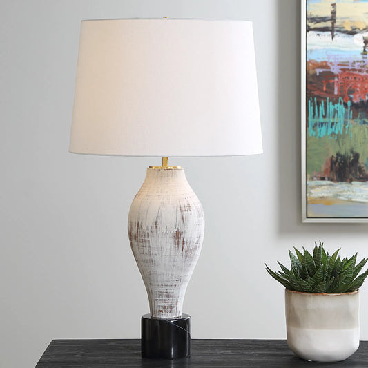 Magdaline Rustic Table Lamp by Uttermost in brass. Made from porcelain, marble, fabric, steel in a transitional style.