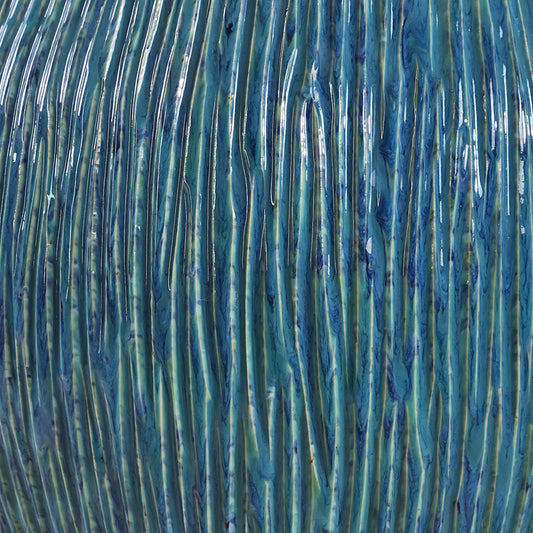 Elysia Textured Table Lamp by Uttermost in brass. Made from ceramic, iron, fabric in a eclectic & global style.