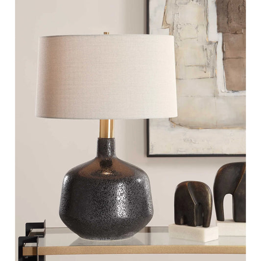 Flanagan Mottled Gloss Table Lamp by Uttermost in brass. Made from steel, ceramic, fabric in a modern style.
