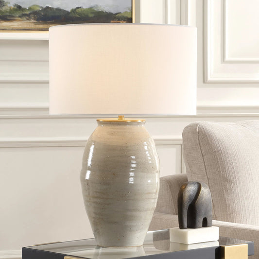 Amos Ceramic Table Lamp by Uttermost in gold. Made from steel, ceramic, fabric in a modern style.