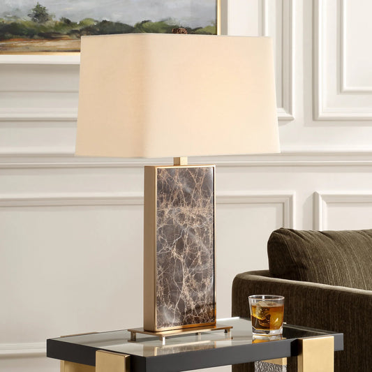 Lafferty Table Lamp by Uttermost in dark brown, plated brass. Made from marble, metal, fabric in a modern style.