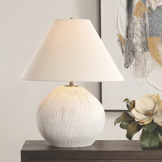 Meryl Table Lamp by Uttermost in brass. Made from porcelain, fabric, steel in a transitional style.