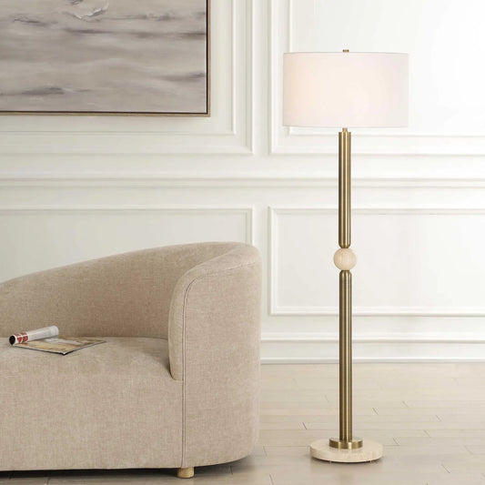 Hudson Floor Lamp by Uttermost in gold. Made from steel, travertine, fabric in a transitional style.