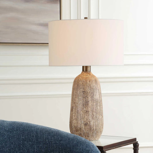 Napier Earthy Table Lamp by Uttermost in brown. Made from ceramic, metal, fabric in a transitional style.