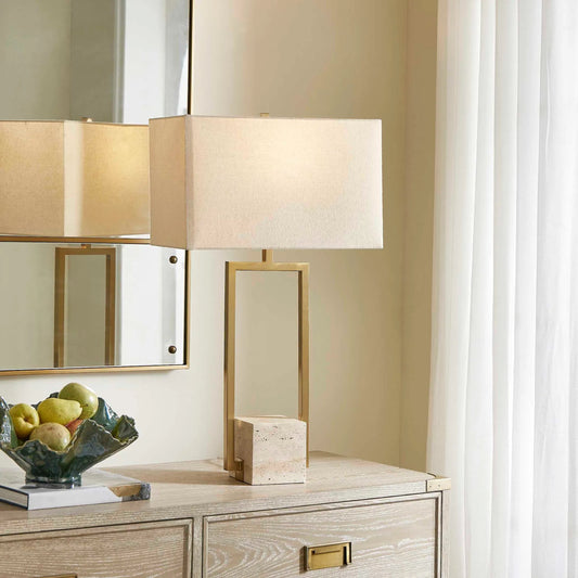 Warrick Table Lamp by Uttermost in brass. Made from steel, travertine, fabric in a transitional style.
