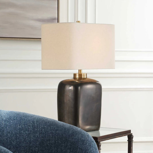 Quentin Table Lamp by Uttermost in dark bronze. Made from ceramic, metal, fabric in a modern style.