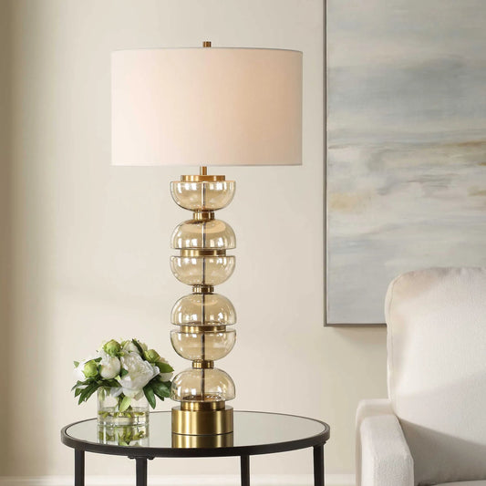 Assemble Half-Sphere Table Lamp by Uttermost in brass. Made from glass, iron, fabric in a modern style.