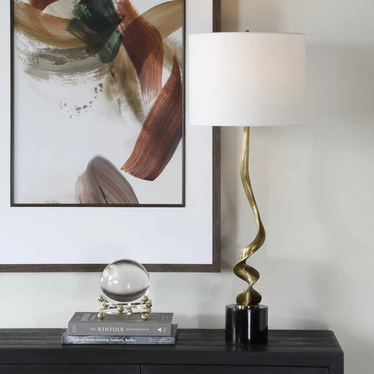 Spiraling Cordless Buffet Lamp by Uttermost in black, gold and brass. Made from metal, marble, fabirc in a unique style.