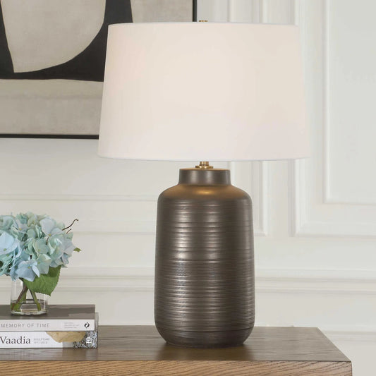 Calderone Table Lamp by Uttermost in black, bronze, brown. Made from porcelain, fabric, steel in a modern style.