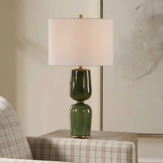 Meyer Table Lamp by Uttermost in green and brass. Made from ceramic, iron, fabric in a unique style.