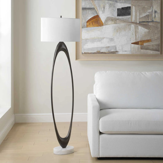 Sonic Open Oval Floor Lamp by Uttermost in dark bronze. Made from marble, resin, iron, fabric in a unique style.