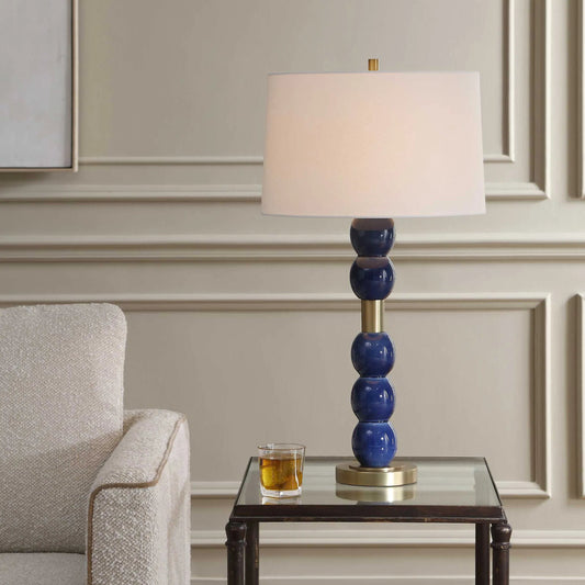 Bellore Glaze Table Lamp by Uttermost in blue and brass. Made from ceramic, iron, fabric in a unique style.