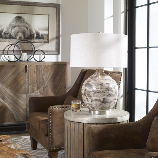 Tamula Distressed Ivory Table Lamp by Uttermost. Made from ceramic, iron in a modern style.