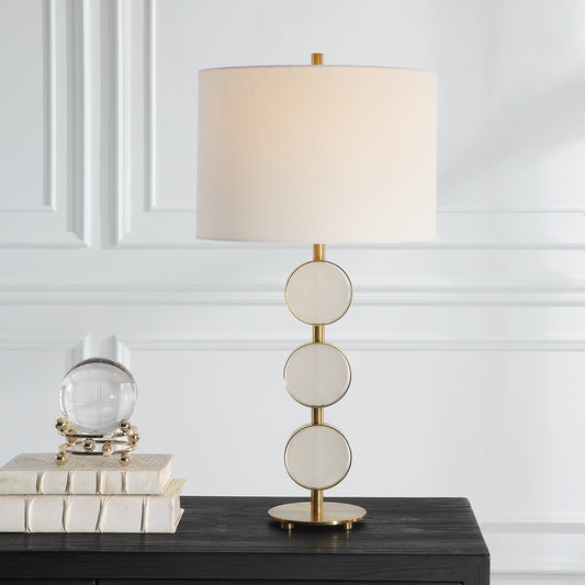 Three Rings Table Lamp by Uttermost in brass. Made from metal, alabaster, fabric in a modern style.