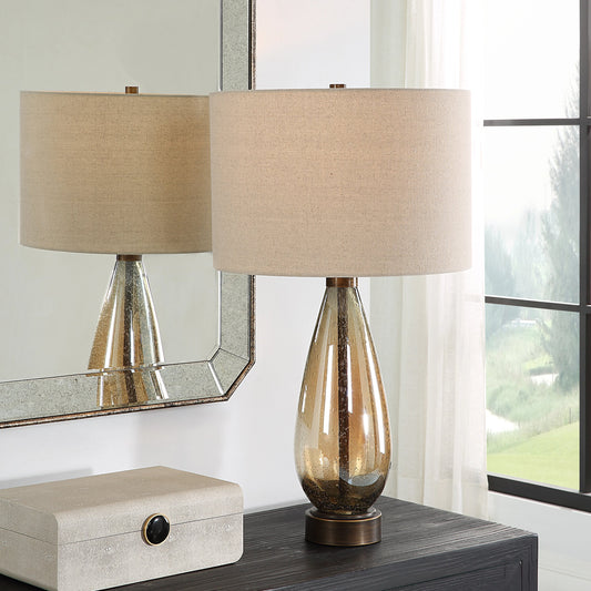 Baltic Table Lamp by Uttermost in bronze. Made from glass, iron, fabric in a modern style.