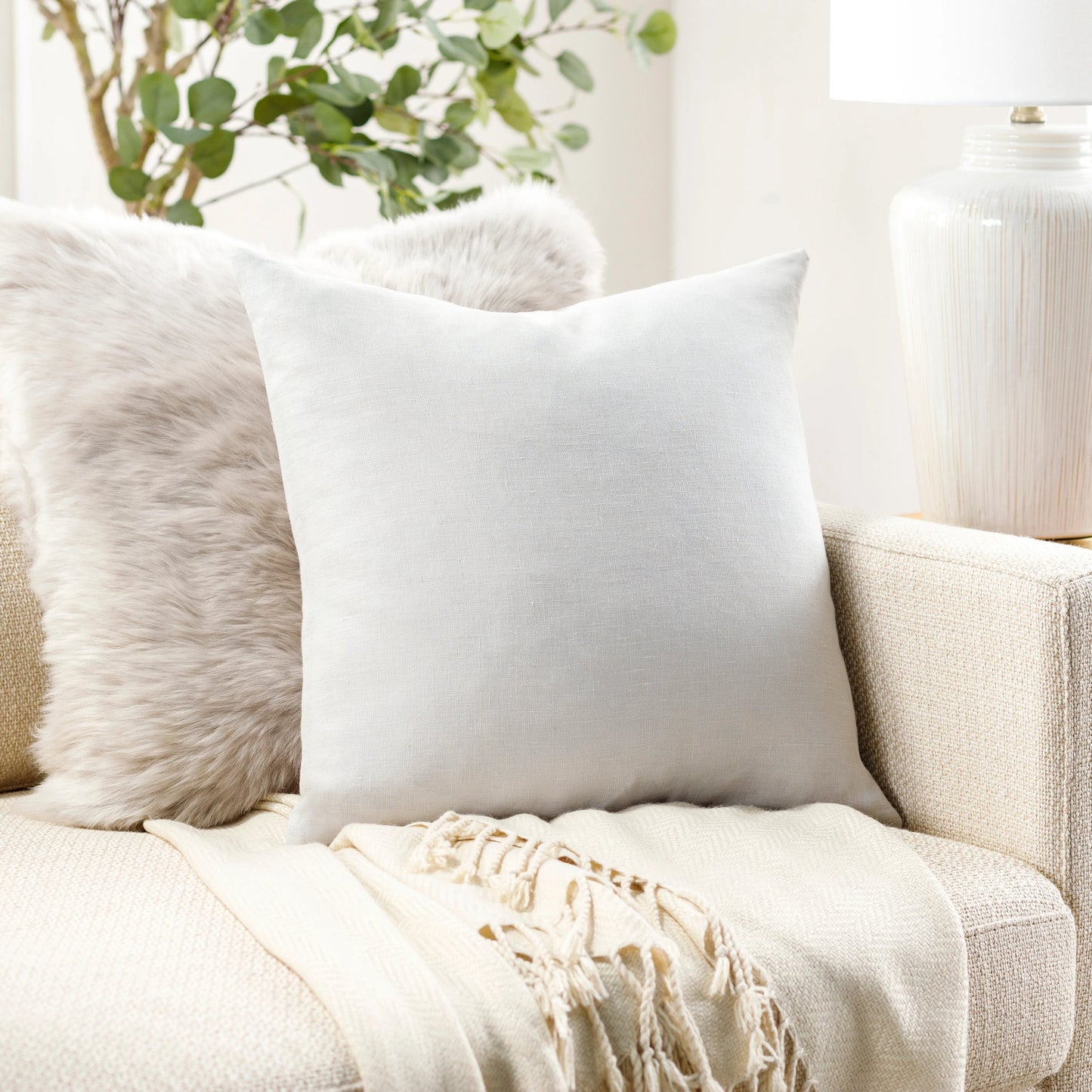 007 SI-1914871,SI-1914872,SI-1914873 | Lifestyle | Linen Solid Pillow - 19229 by Livabliss in null. Made from front: 100% linen, back: 100% linen in a modern style.