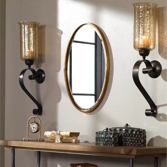 Herleva Mirror by Uttermost in gold. Made from metal in a modern style.