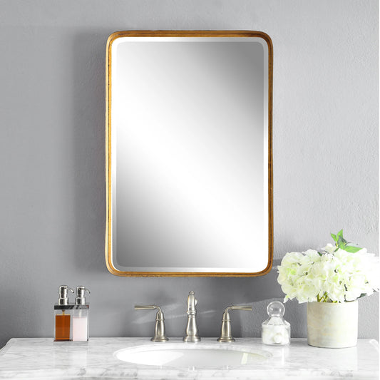 Crofton Vanity Mirror by Uttermost in gold. Made from metal in a modern style.