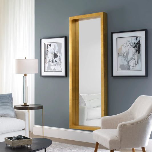Edmonton Gold Leaner Mirror by Uttermost in gold. Made from pine in a modern style.