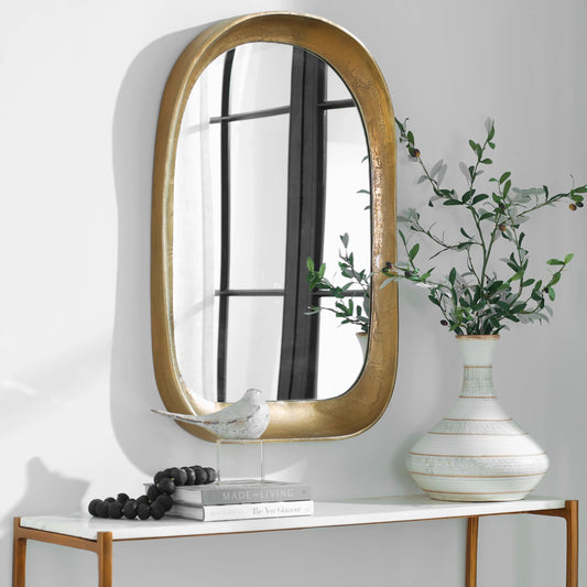 Bradano Arch Mirror by Uttermost in brass. Made from cast aluminum, glass, mdf in a modern style.