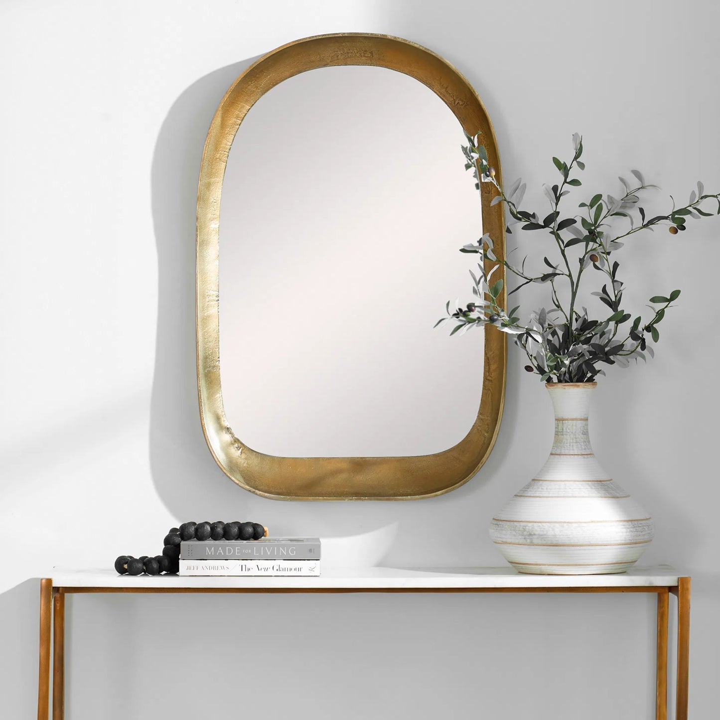 008 SI-2146802 | Lifestyle | Bradano Arch Mirror by Uttermost in brass. Made from cast aluminum, glass, mdf in a modern style.