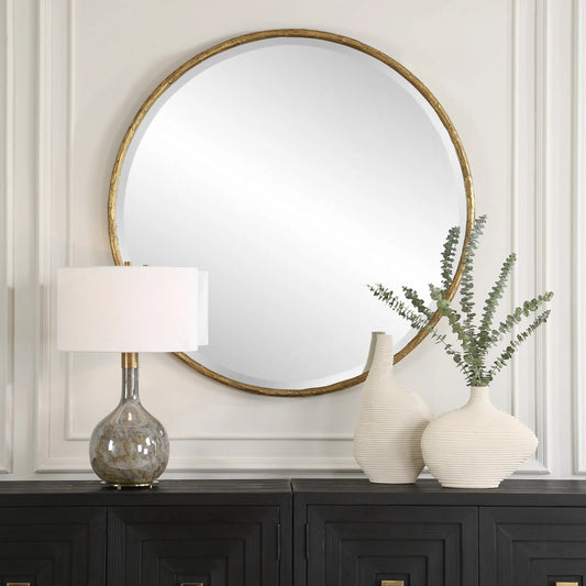 Sutton Round Mirror by Uttermost in gold. Made from iron, mirror, mdf in a transitional style.