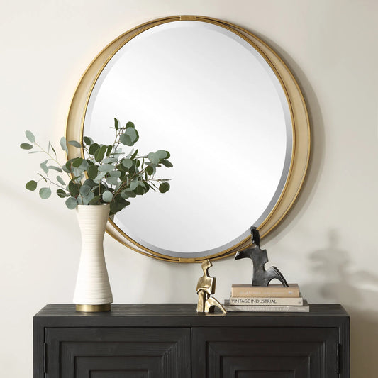Rhodes Round Mirror by Uttermost in gold leaf. Made from iron, mirror, mdf in a transitional style.