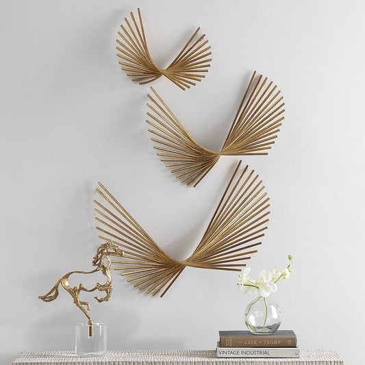 Coreograph Antique Wall Decor by Uttermost in gold leaf. Made from iron in a modern style.
