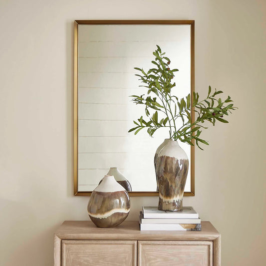 Heisler Mirror by Uttermost in brass. Made from stainless steel, mdf, mirror in a transitional style.
