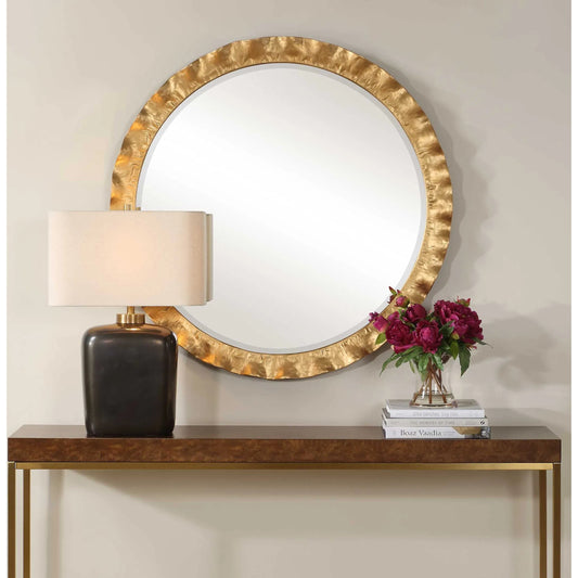 Haya Round Mirror by Uttermost in gold leaf. Made from iron, mirror, mdf in a transitional style.