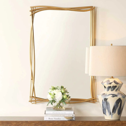 Curved Branches Mirror by Uttermost in gold leaf. Made from iron, mirror in a transitional style.
