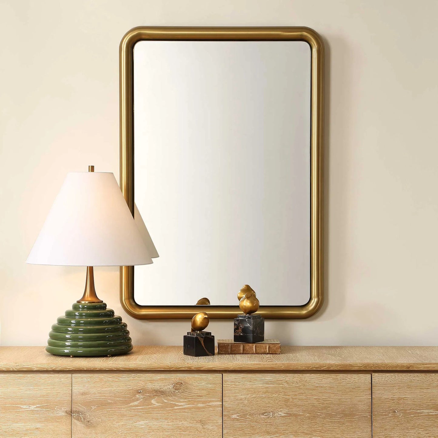 003 SI-2526142 | Lifestyle | Atkinson Modern Mirror by Uttermost in antique brass. Made from stainless steel, mdf, mirror in a unique style.