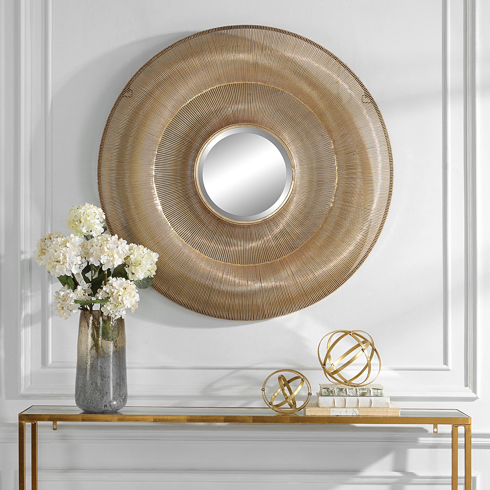 Bauble Round Mirror by Uttermost in antique gold. Made from iron, mirror, mdf in a coastal style.