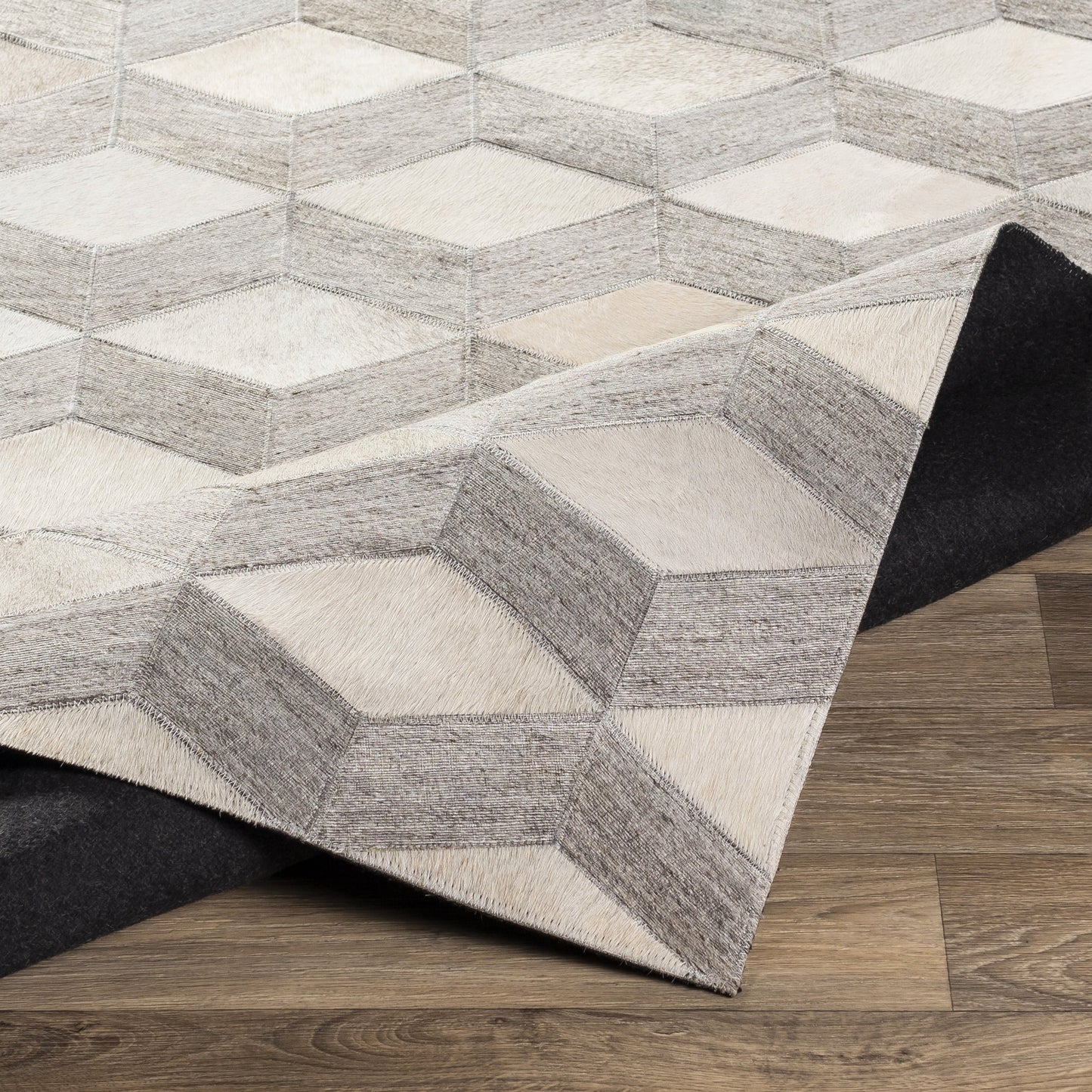 003 SR-754356 | Closeup | Medora Rug - 22910 by Surya in oatmeal, light gray, medium gray. Made from 65% hair on hide, 35% chenille-viscose in a unique style.