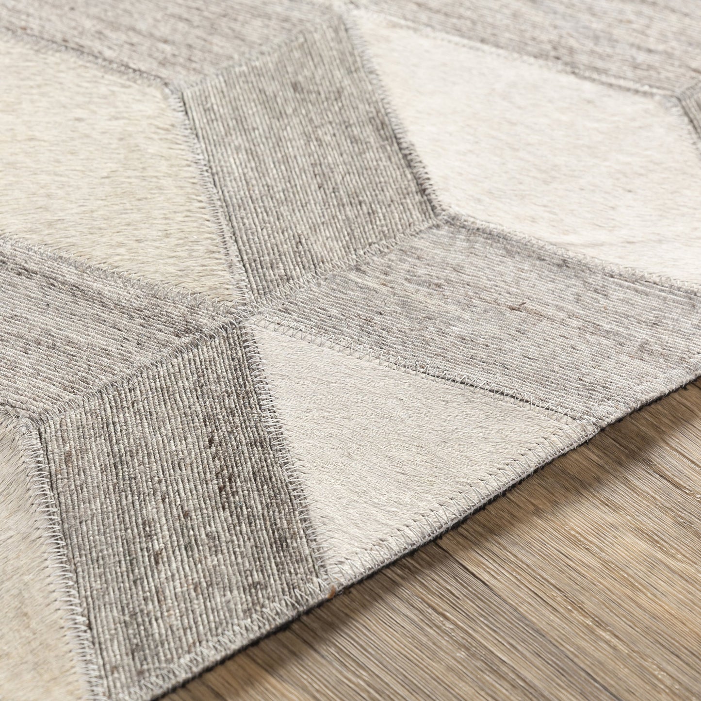 006 SR-754356 | Closeup | Medora Rug - 22910 by Surya in oatmeal, light gray, medium gray. Made from 65% hair on hide, 35% chenille-viscose in a unique style.