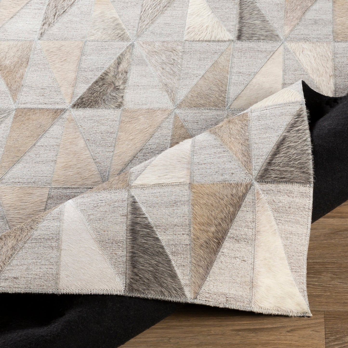 005 SI-1886212 | Closeup | Medora Rug - 25364 by Surya in charcoal, cream, beige, light gray, medium gray. Made from 60% viscose, 40% hair on hide in a unique style.