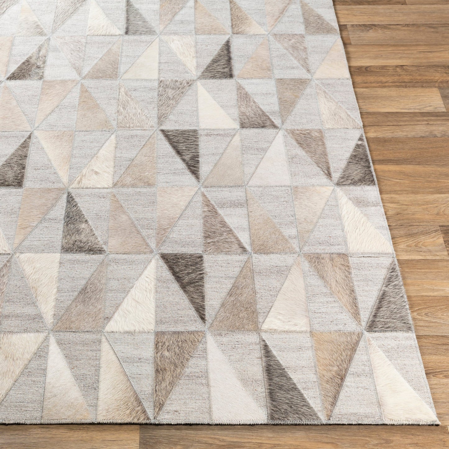 004 SI-1886212 | Closeup | Medora Rug - 25364 by Surya in charcoal, cream, beige, light gray, medium gray. Made from 60% viscose, 40% hair on hide in a unique style.