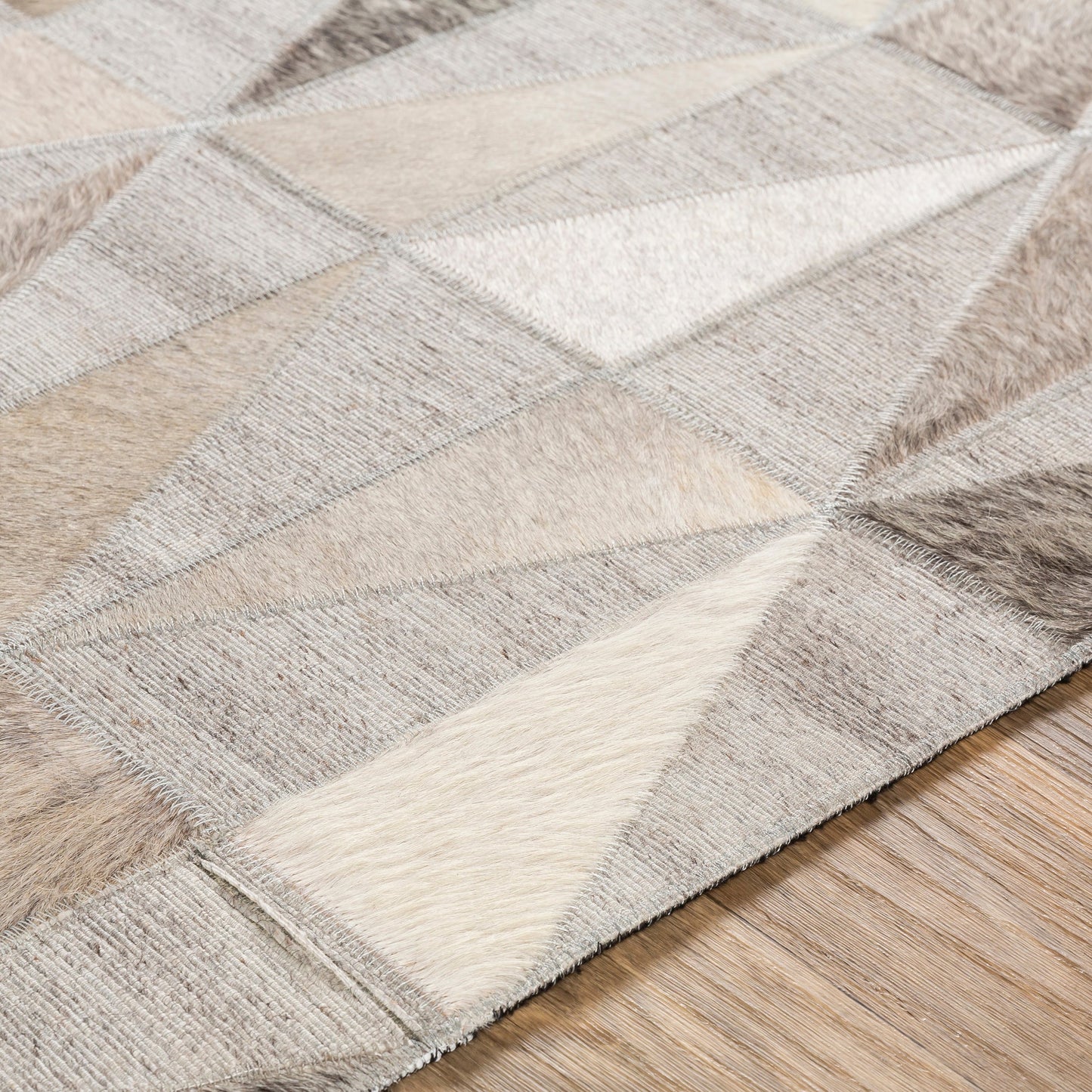 003 SI-1886212 | Closeup | Medora Rug - 25364 by Surya in charcoal, cream, beige, light gray, medium gray. Made from 60% viscose, 40% hair on hide in a unique style.