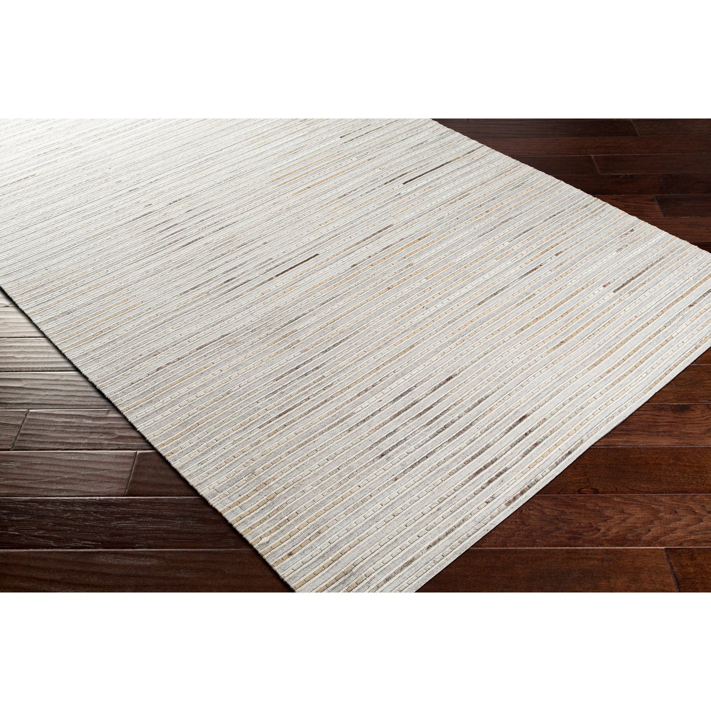 003 SI-1886215,SI-1886217,SI-1886218 | Closeup | Medora Rug - 26072 by Surya in taupe, dark brown, oatmeal, black, medium gray. Made from 50% wool, 30% hair on hide, 20% viscose in a unique style.