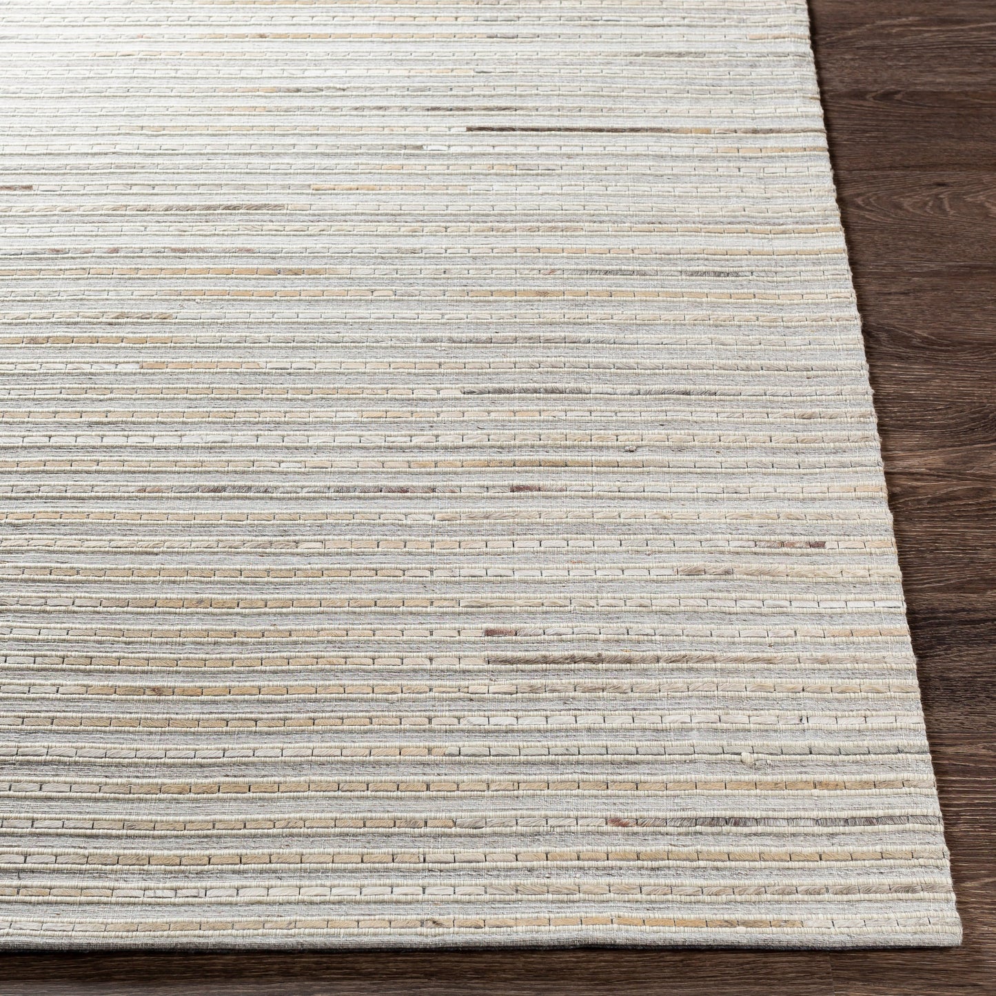 006 SI-1886215,SI-1886217,SI-1886218 | Closeup | Medora Rug - 26072 by Surya in taupe, dark brown, oatmeal, black, medium gray. Made from 50% wool, 30% hair on hide, 20% viscose in a unique style.
