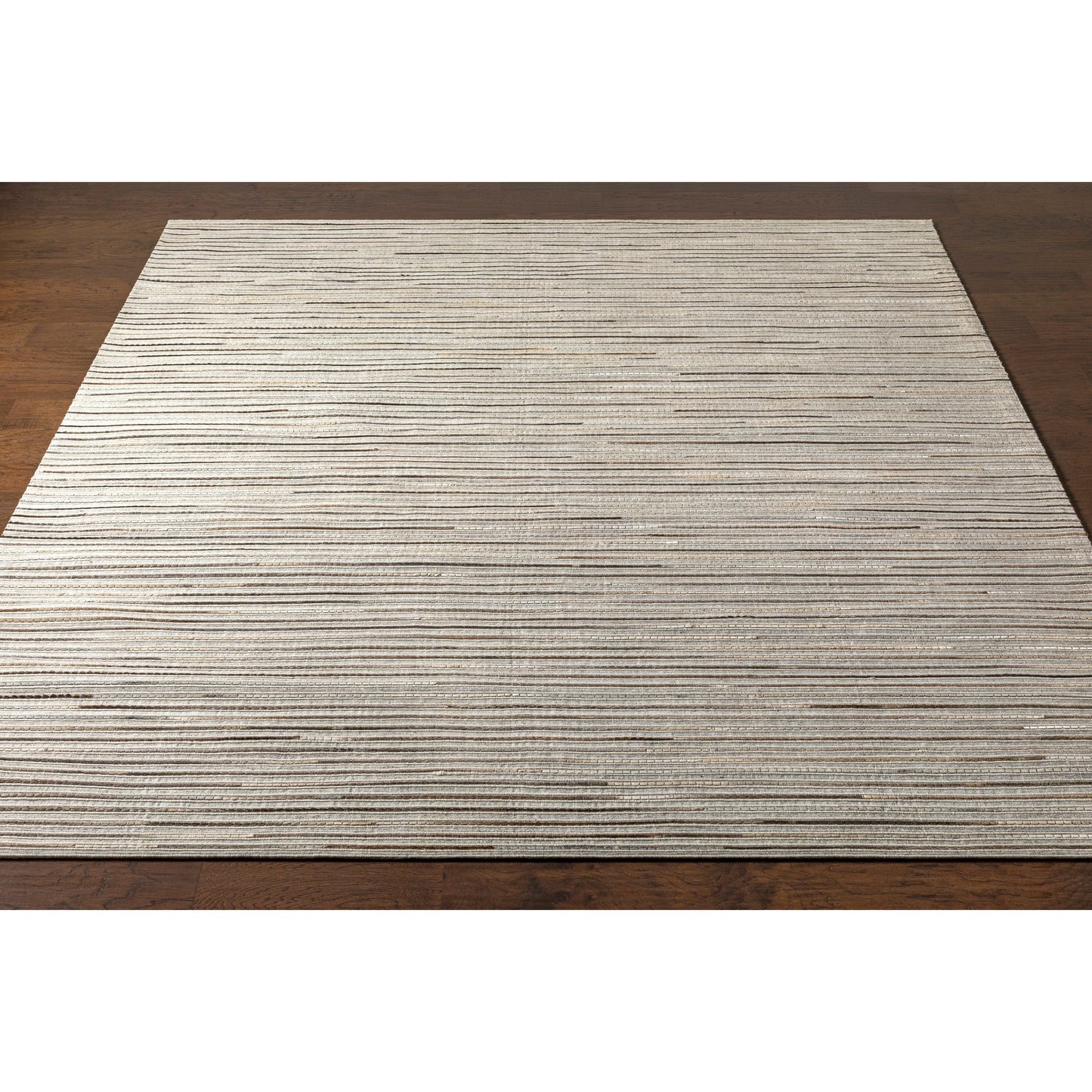 004 SI-1886215,SI-1886217,SI-1886218 | Closeup | Medora Rug - 26072 by Surya in taupe, dark brown, oatmeal, black, medium gray. Made from 50% wool, 30% hair on hide, 20% viscose in a unique style.