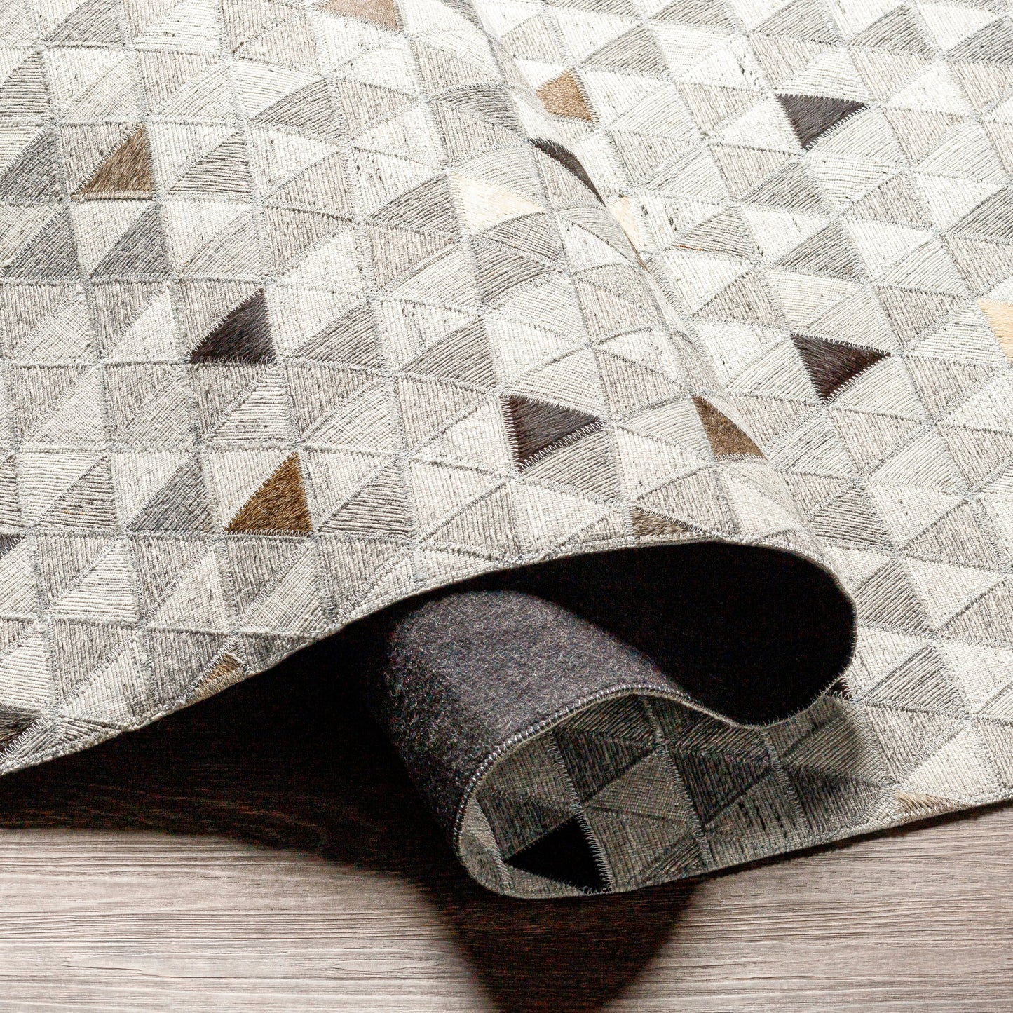 005 SI-1886223,SI-1886224,SI-1886226 | Closeup | Medora Rug - 30191 by Surya in gray, black, light gray, medium brown, light brown, tan. Made from 65% viscose, 35% leather in a unique style.