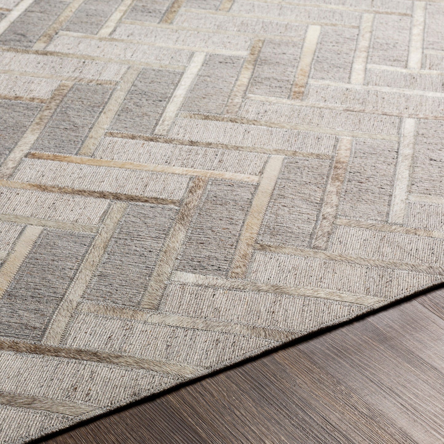 004 SI-1886227,SI-1886228,SI-1886229,SI-1886230 | Closeup | Medora Rug - 30192 by Surya in taupe, medium gray, oatmeal, tan, medium brown, light gray. Made from 65% viscose, 35% leather in a unique style.