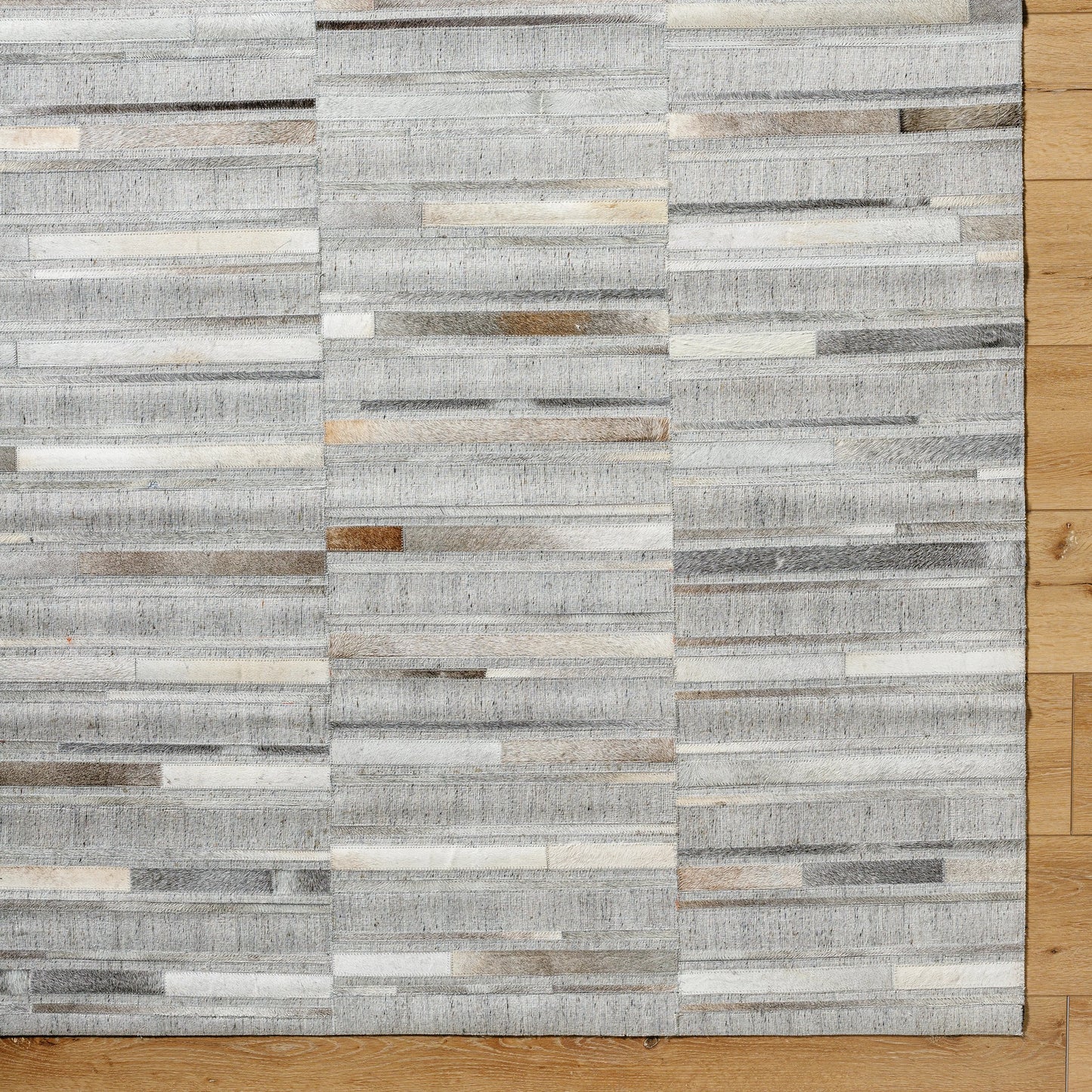 007 SI-2052144,SI-2052145,SI-2052146,SI-2052147 | Closeup | Medora Rug - 489431 by Surya in taupe, ivory, stone grey, charcoal. Made from face: 60% leather, 40% viscose in a unique style.