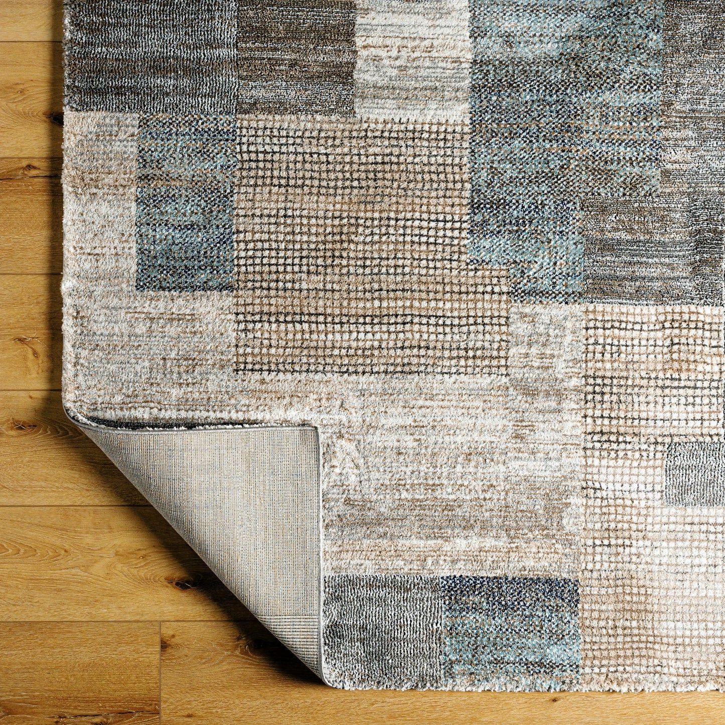 003 SI-2053054,SI-2053055,SI-2053057 | Closeup | Montana Rug - 494863 by Livabliss in ivory, tan, gray, black, dark blue, pale blue. Made from face: 85% polypropylene, 15% polyester, warp: 100% jute in a unique style.