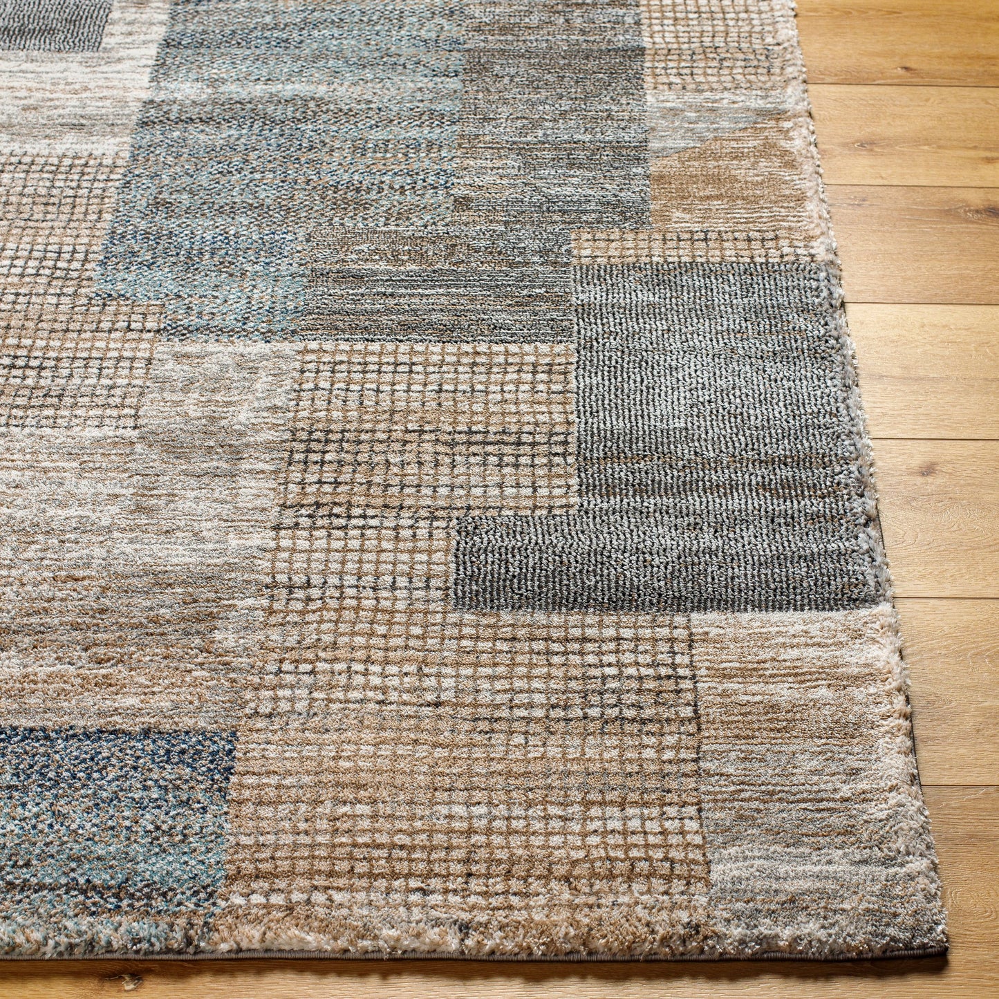 002 SI-2053054,SI-2053055,SI-2053057 | Closeup | Montana Rug - 494863 by Livabliss in ivory, tan, gray, black, dark blue, pale blue. Made from face: 85% polypropylene, 15% polyester, warp: 100% jute in a unique style.