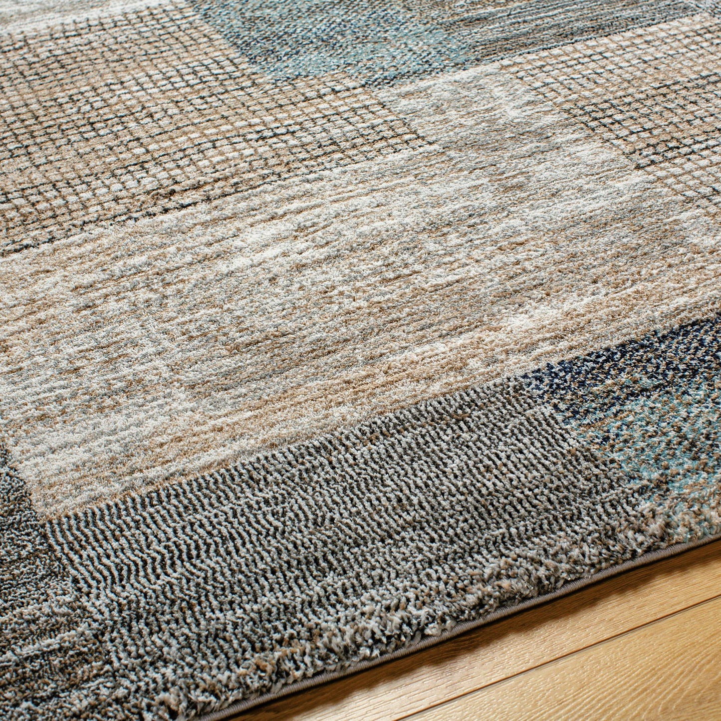 004 SI-2053054,SI-2053055,SI-2053057 | Closeup | Montana Rug - 494863 by Livabliss in ivory, tan, gray, black, dark blue, pale blue. Made from face: 85% polypropylene, 15% polyester, warp: 100% jute in a unique style.