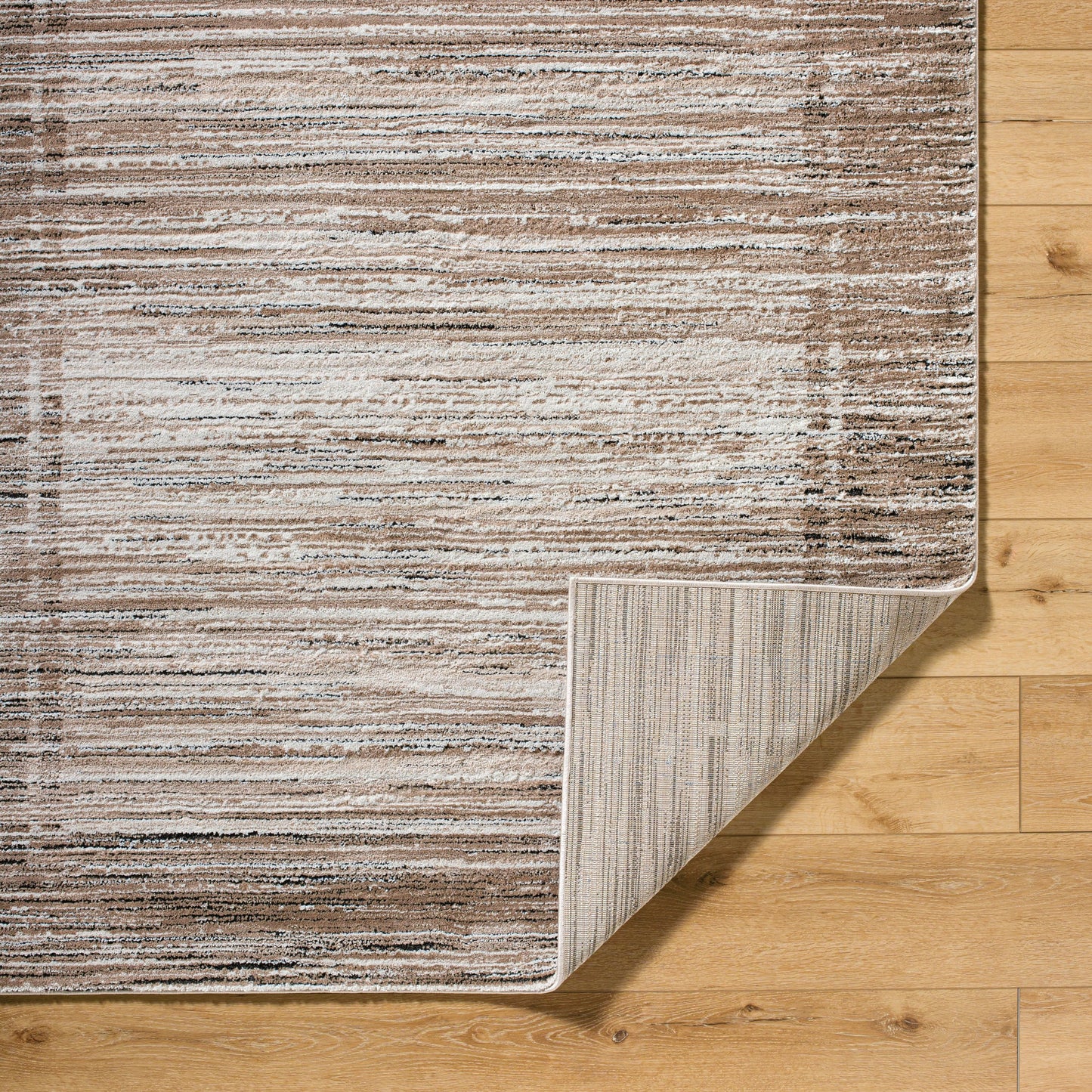002 SI-2165629,SI-2165630,SI-2165631,SI-2165632 | Closeup | Montana Rug - 536280 by Livabliss in tan, ivory, light beige, black. Made from polypropylene, polyester in a unique style.